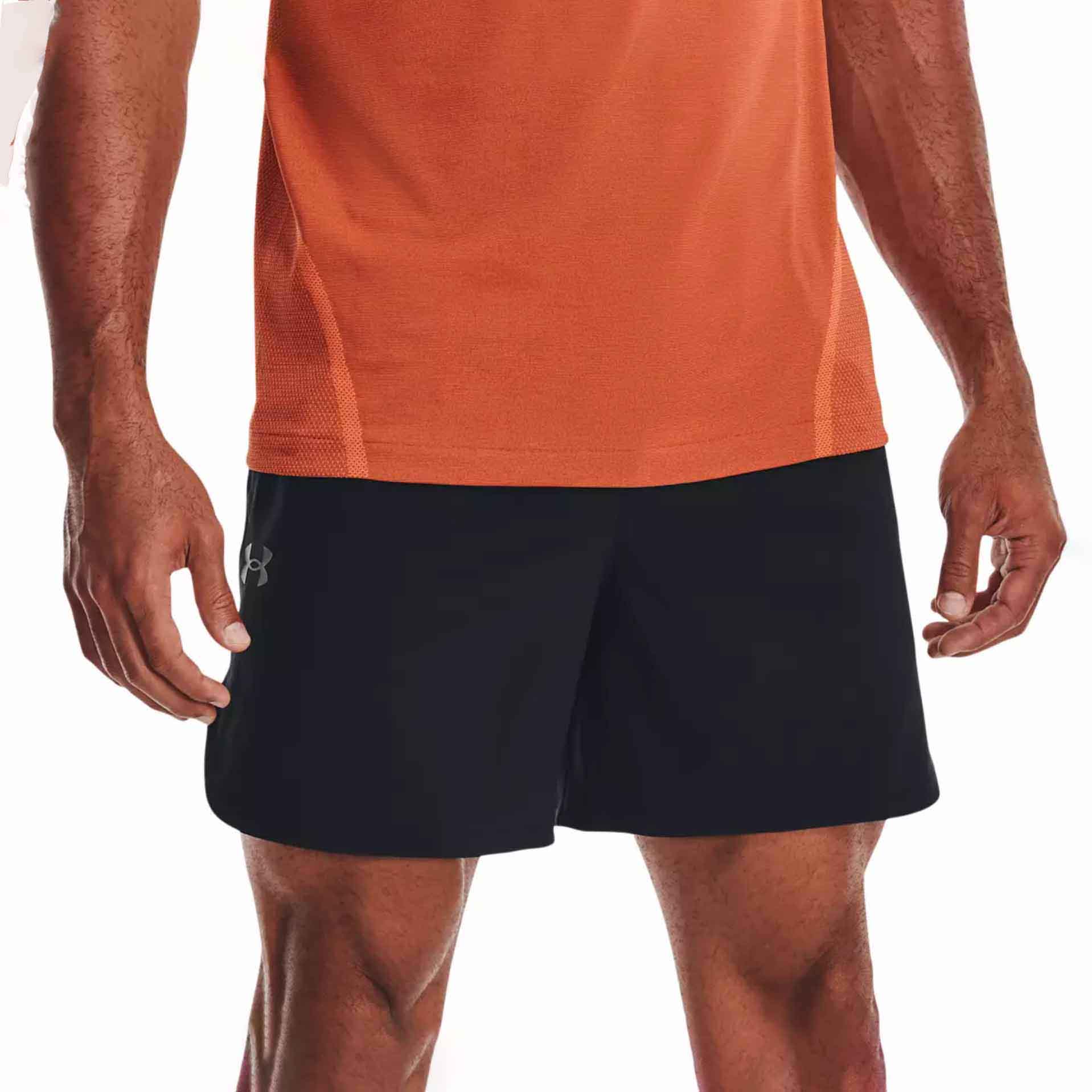 Mean wearing orange shirt and black gym shorts